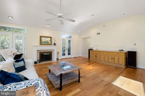 a living room with furniture fireplace and a table