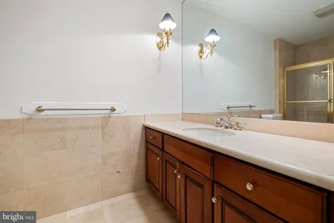 a bathroom with a toilet a sink and vanity