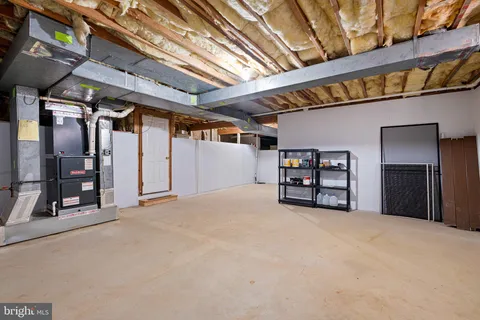 a utility room with sink dryer and washer