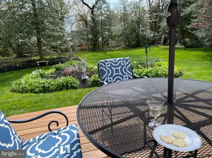a view of a garden with wooden fence