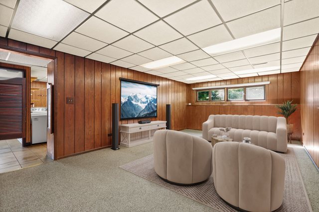 808 Burning Tree Lane Naperville, IL 60563 - Photo 24 of 34 a living room with furniture and a flat screen tv