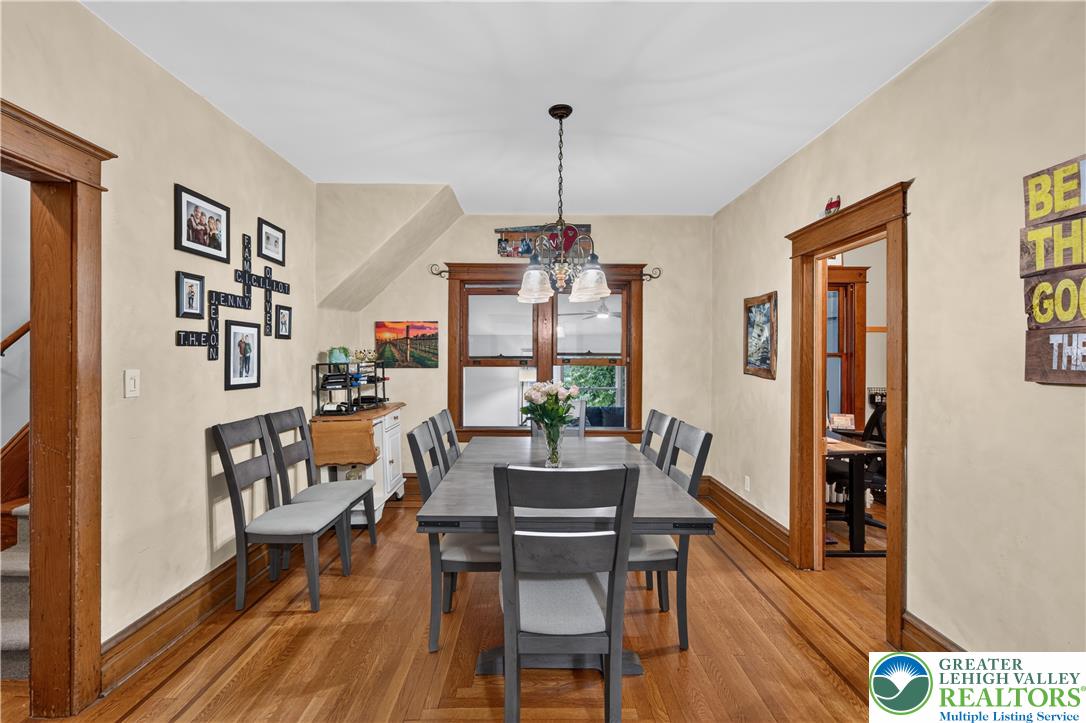 534 Ridge Street Emmaus, PA 18049 - Photo 14 of 40 a dining room with furniture a chandelier and wooden floor