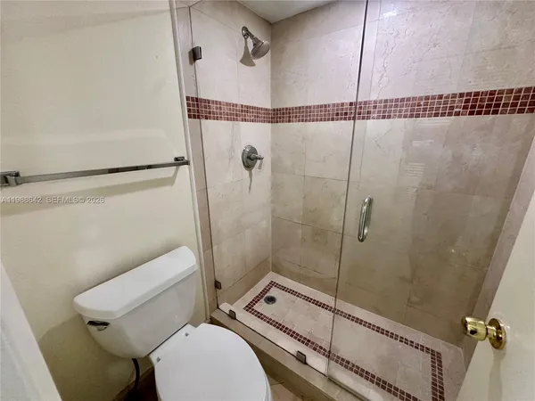 a room with lots of tables and large windows