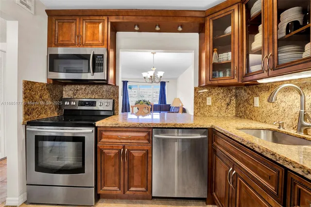 a kitchen with a sink and a microwave