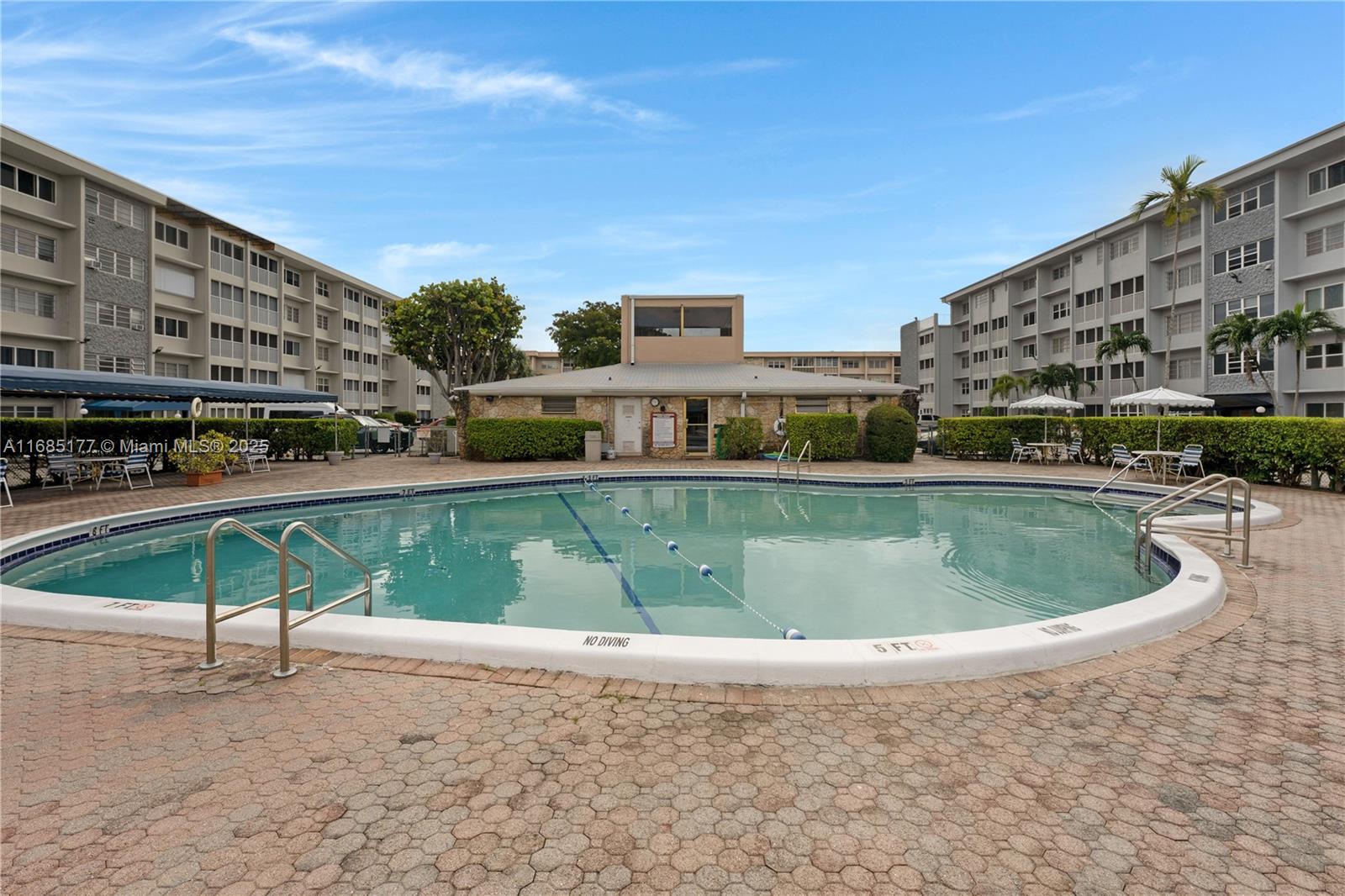 410 Southeast 2nd Street, Unit 220 Hallandale Beach, FL 33009 - Photo 24 of 25 a view of a swimming pool with a yard