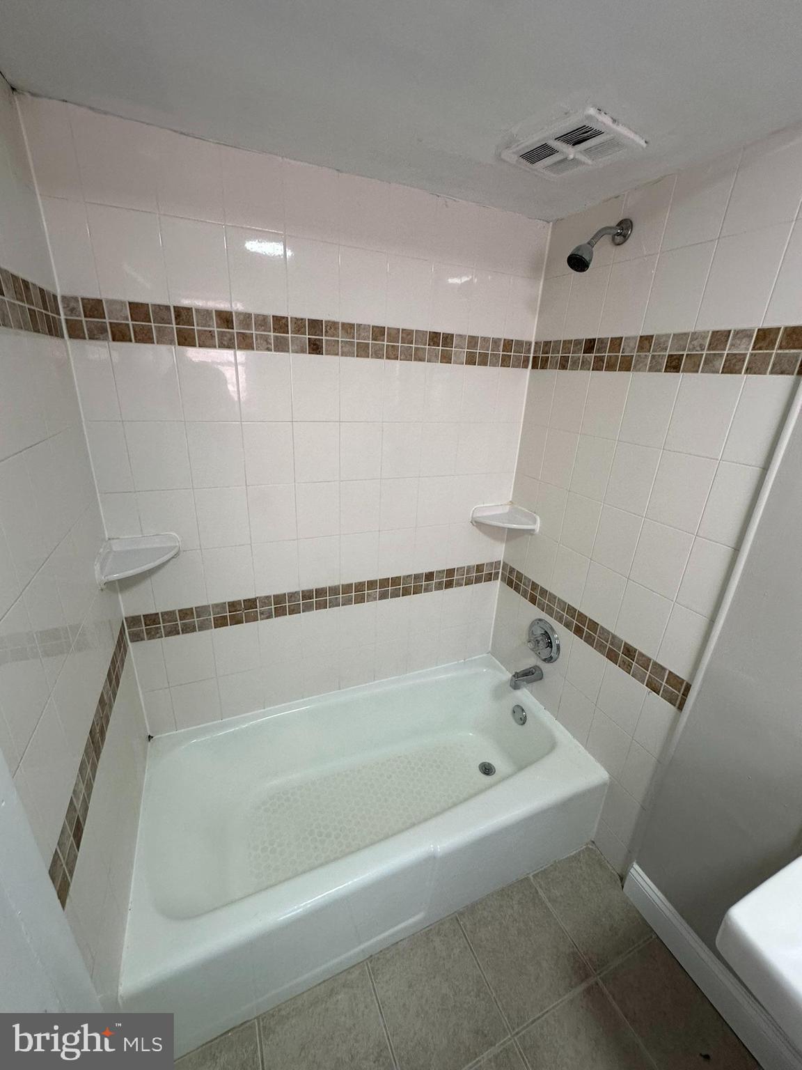 7028 Paschall Avenue Philadelphia, PA 19142 - Photo 21 of 21 a bathroom with a shower and a tub