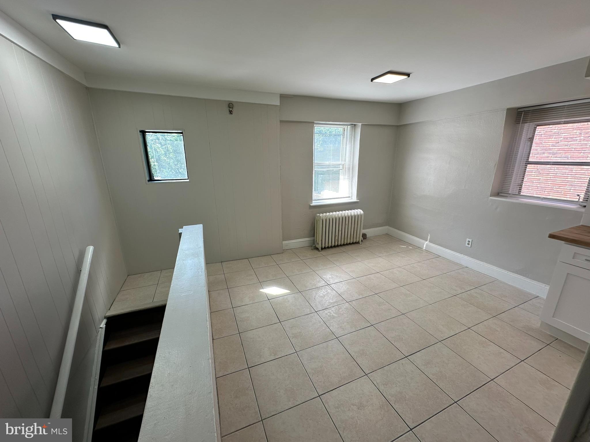 7028 Paschall Avenue Philadelphia, PA 19142 - Photo 6 of 21 a view of an empty room with a window