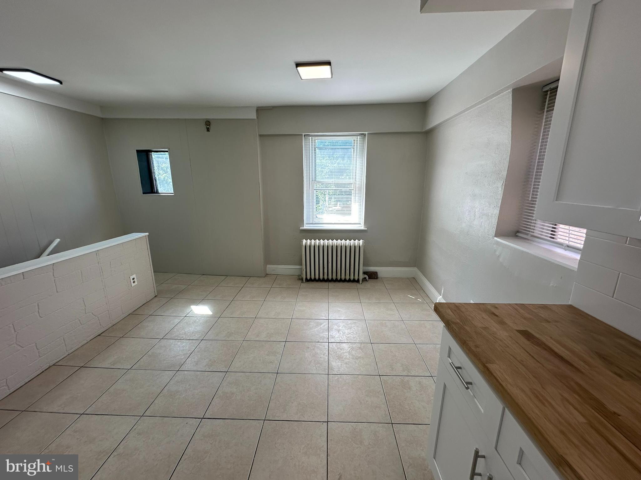 7028 Paschall Avenue Philadelphia, PA 19142 - Photo 7 of 21 a view of an empty room with a window