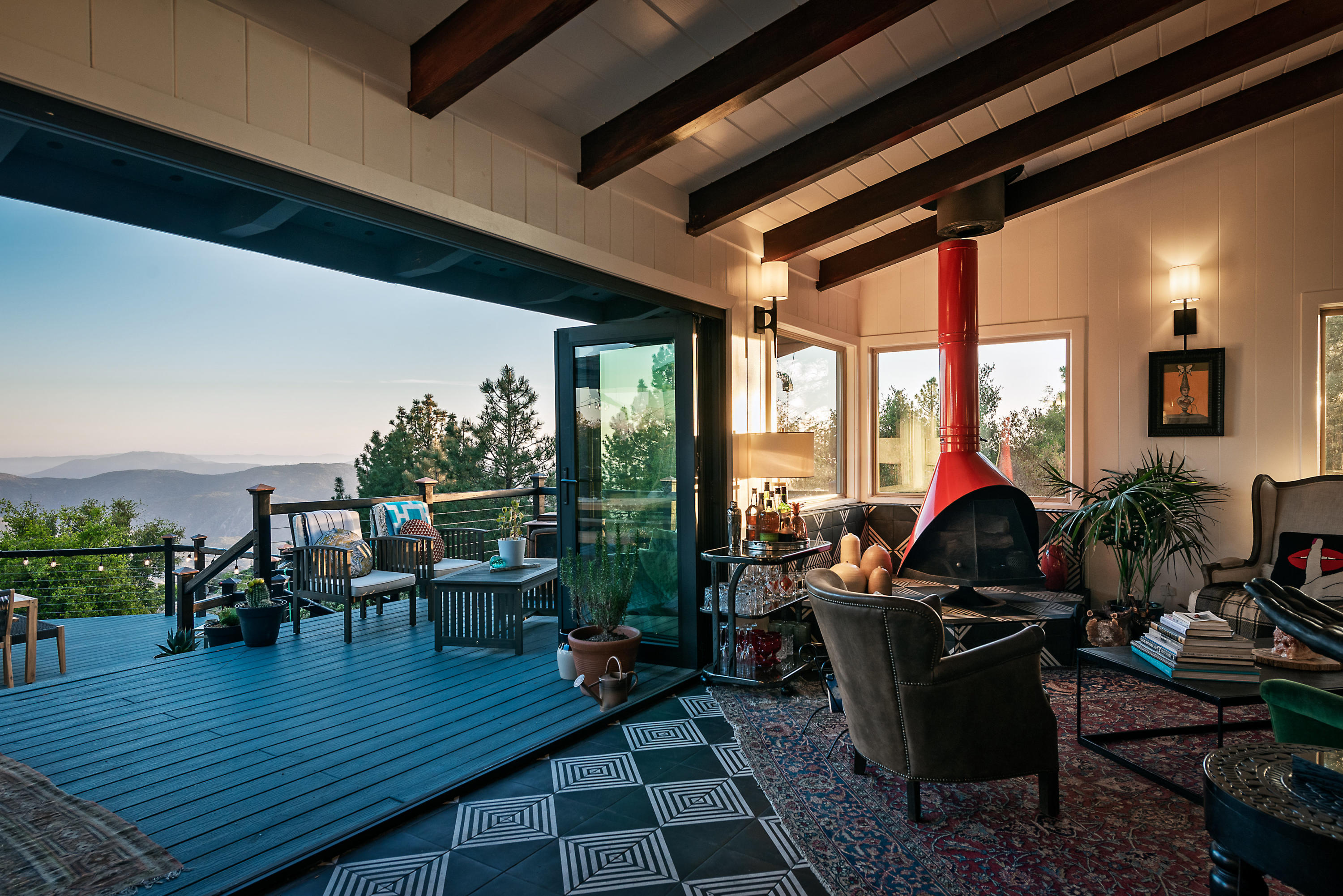 52421 Double View Drive Idyllwild, CA 92549 - Photo 26 of 73 a living room with furniture dining table a large window and a potted plant