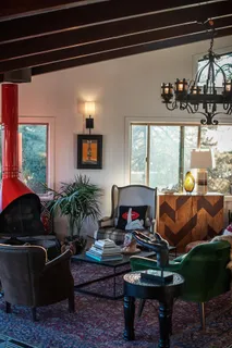 a living room with furniture and large windows