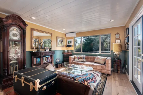 a view of balcony with furniture