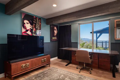 a view of a chairs and table on the deck