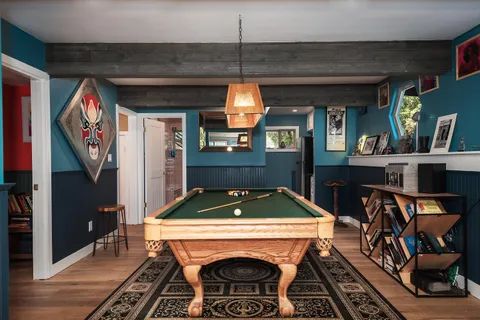 a view of a balcony with mountain view and wooden floor