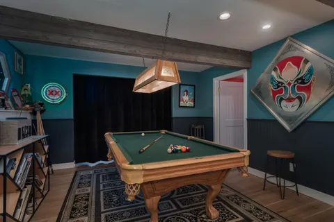 a terrace with outdoor seating and wooden floor