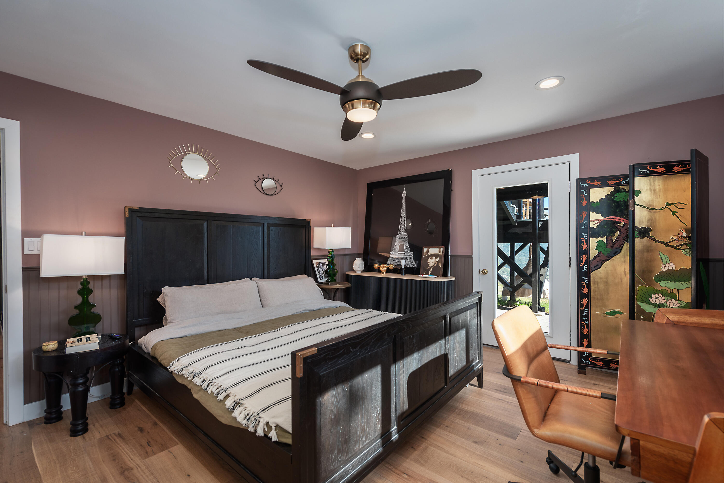 52421 Double View Drive Idyllwild, CA 92549 - Photo 47 of 73 a bedroom with a bed a desk and chair with wooden floor