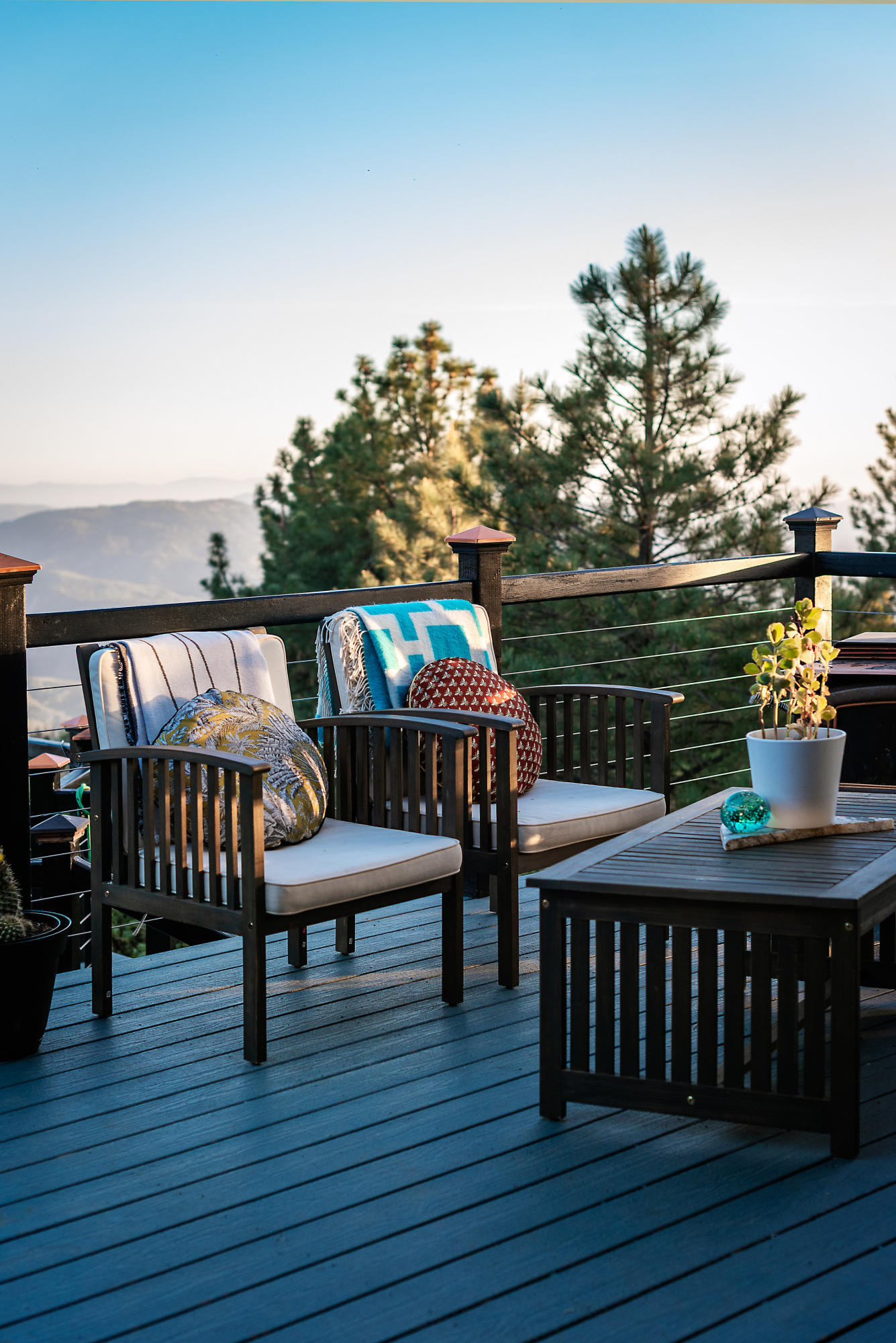 52421 Double View Drive Idyllwild, CA 92549 - Photo 59 of 73 a view of a patio with table and chairs with wooden floor and fence