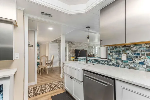 a bathroom with a sink a mirror and a shower