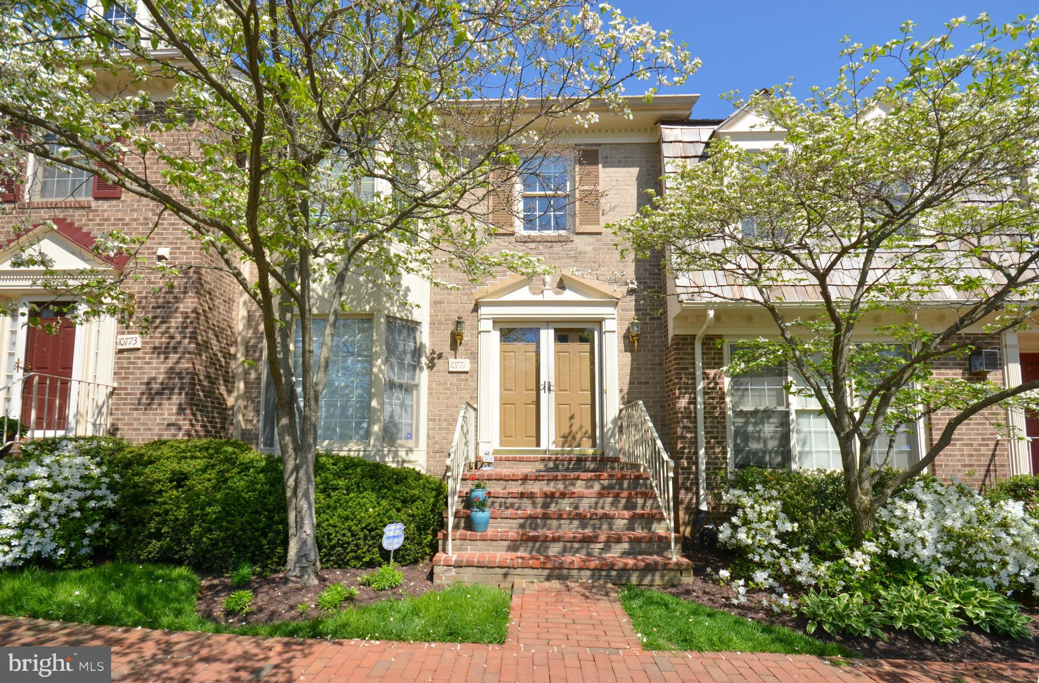 10771 Brewer House Road Rockville, MD 20852 - Photo 1 of 30 a front view of a house with garden