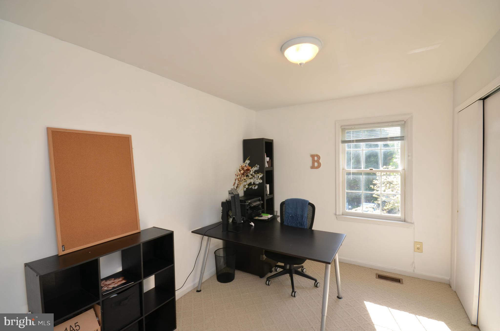 10771 Brewer House Road Rockville, MD 20852 - Photo 12 of 30 a view of a workspace with furniture and a window