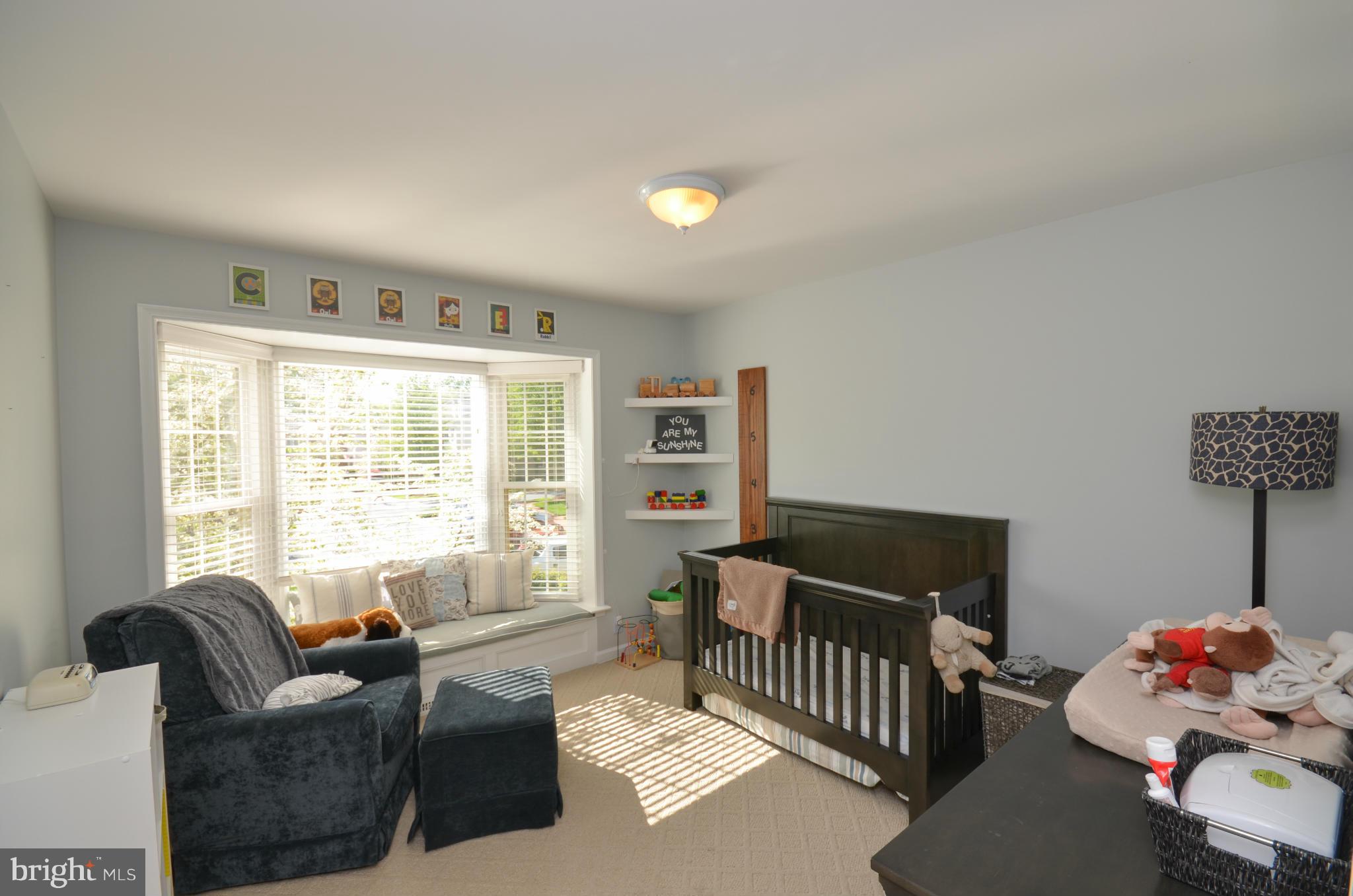 10771 Brewer House Road Rockville, MD 20852 - Photo 15 of 30 a living room with furniture and a large window