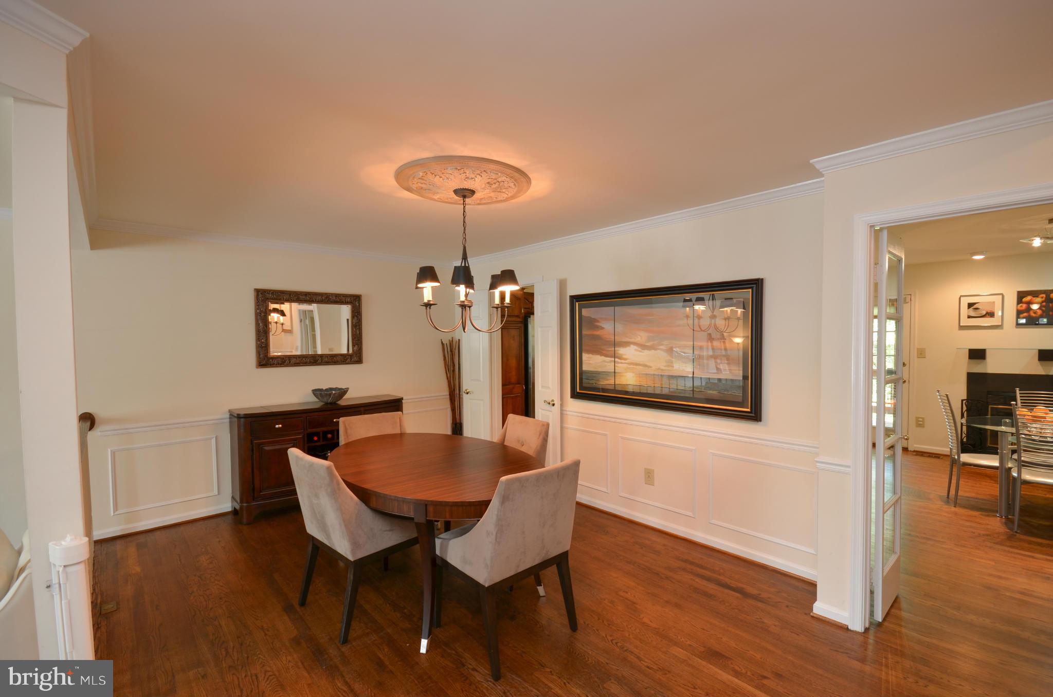 10771 Brewer House Road Rockville, MD 20852 - Photo 3 of 30 a view of a dining room with furniture and wooden floor
