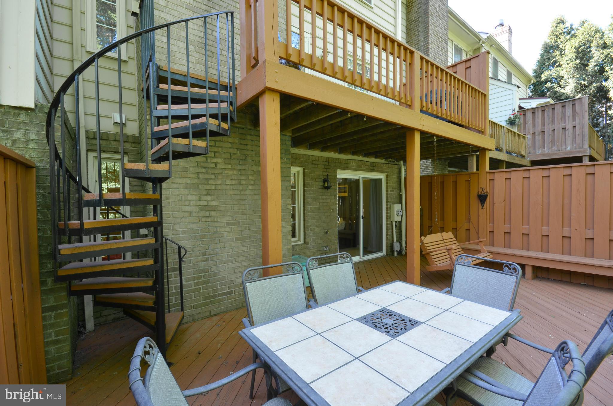10771 Brewer House Road Rockville, MD 20852 - Photo 28 of 30 a backyard of a house with barbeque oven table and chairs