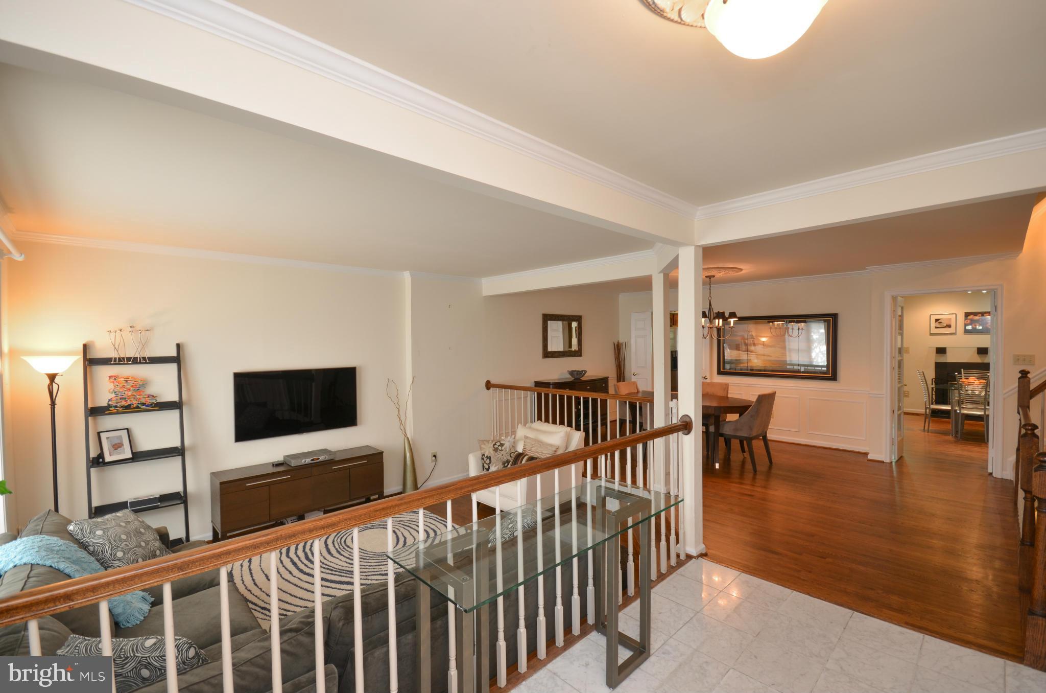 10771 Brewer House Road Rockville, MD 20852 - Photo 4 of 30 a view of a livingroom with furniture and wooden floor