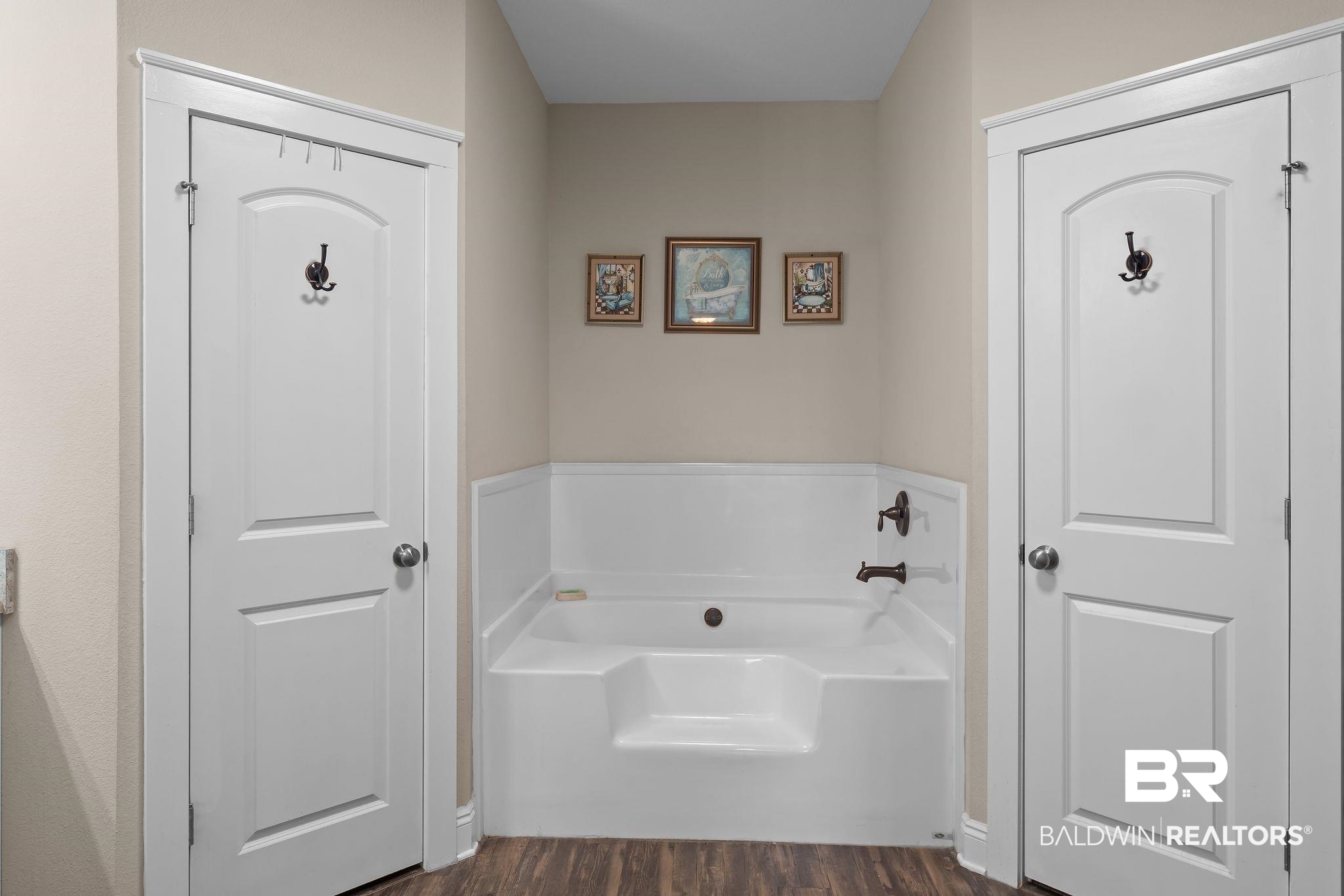 28980 Comstock Road Elberta, AL 36530 - Photo 17 of 38 Bathroom featuring a bath and dark wood finished floors