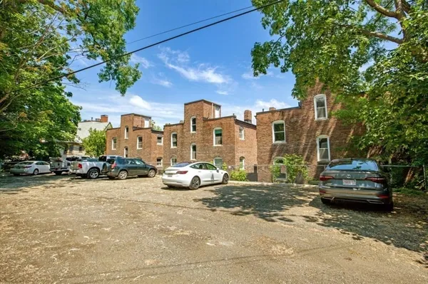 a view of a street with cars