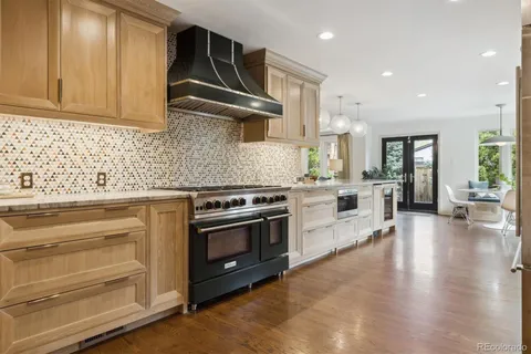 a kitchen with a stove oven and sink