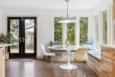 a dining room with furniture window wooden floor