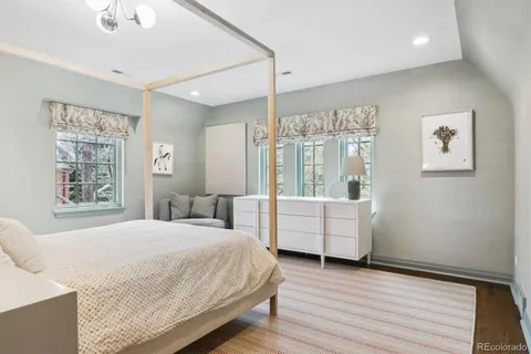 a bedroom with a bed and a couch