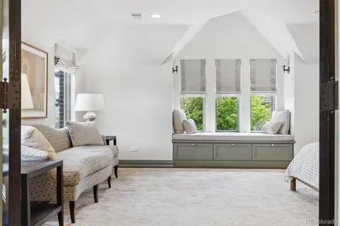 a bathroom with a double vanity sink a mirror and a shower