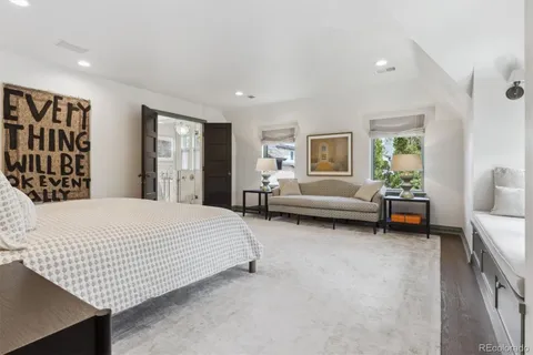 a bathroom with a double sink shower and a mirror