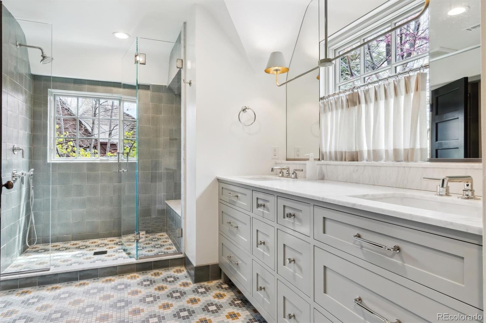 10 Cherry Street Denver, CO 80220 - Photo 24 of 34 a bathroom with a double sink shower and a mirror
