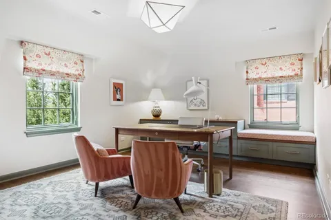 a view of a lounge chairs in back yard of the house