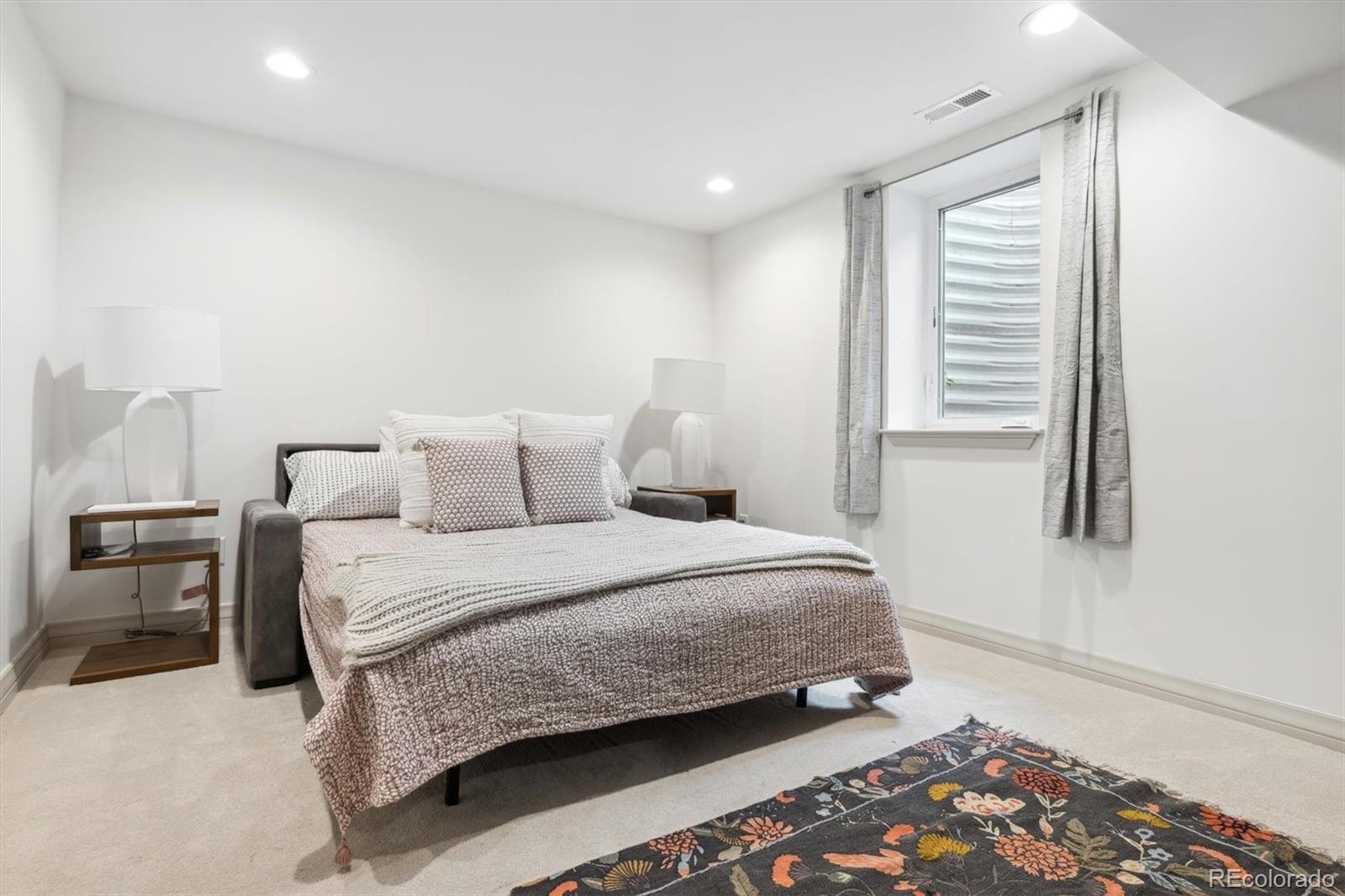 10 Cherry Street Denver, CO 80220 - Photo 29 of 34 a bedroom with a bed and a window