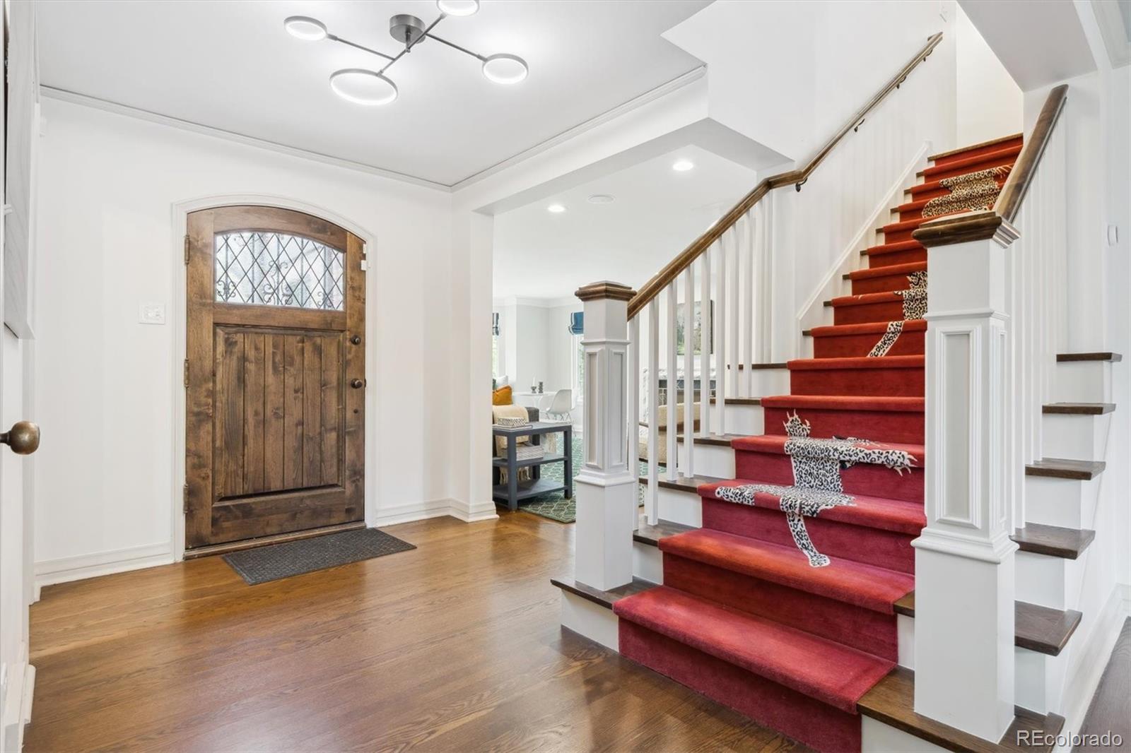 10 Cherry Street Denver, CO 80220 - Photo 5 of 34 a view of entryway with wooden floor and stairs