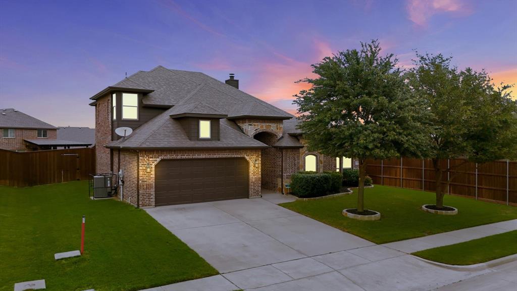 1105 Safrano Street Midlothian, TX 76065 - Photo 24 of 25 a front view of a house with garden