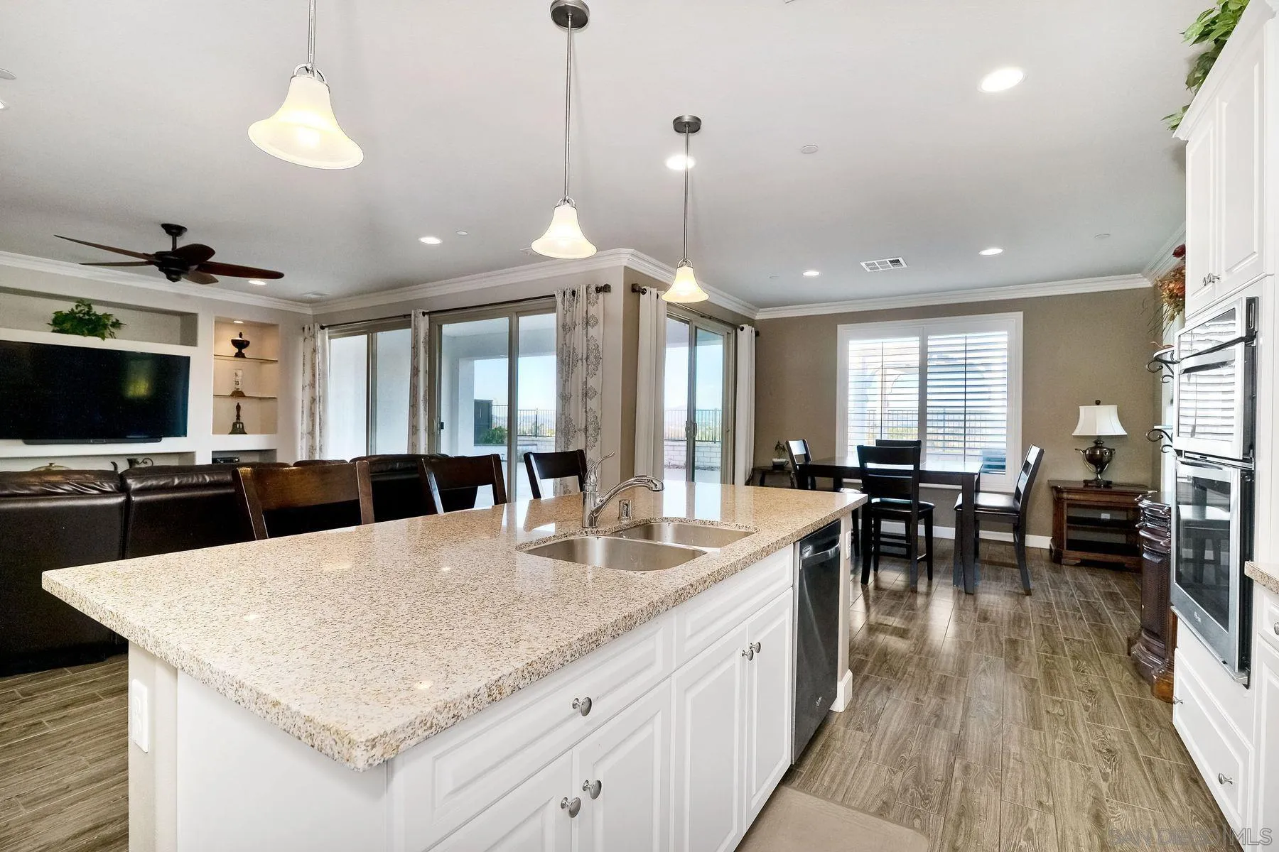 446 Adobe Estates Drive Vista, CA 92083 - Photo 7 of 15 a large kitchen with a table and chairs