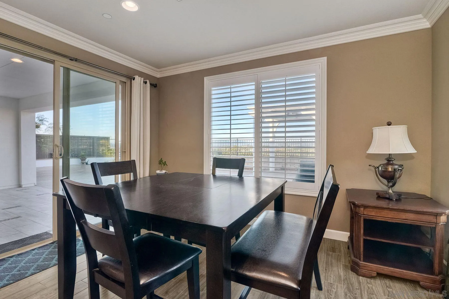 446 Adobe Estates Drive Vista, CA 92083 - Photo 8 of 15 a view of a dining room with furniture and wooden floor