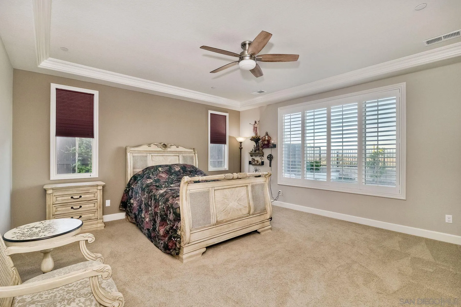 446 Adobe Estates Drive Vista, CA 92083 - Photo 9 of 15 a bed room with a bed and a ceiling fan