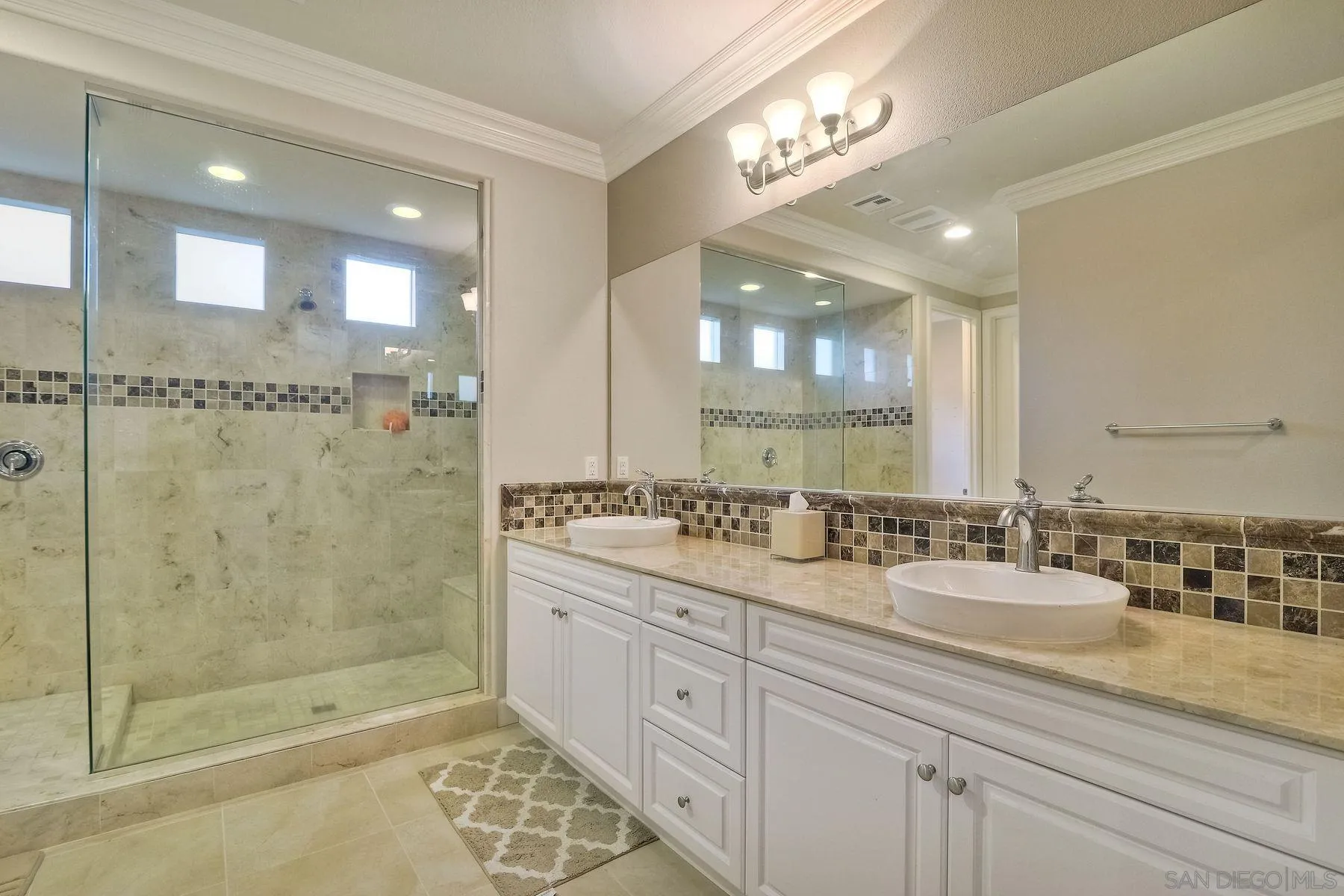 446 Adobe Estates Drive Vista, CA 92083 - Photo 10 of 15 a bathroom with double sink shower and a mirror