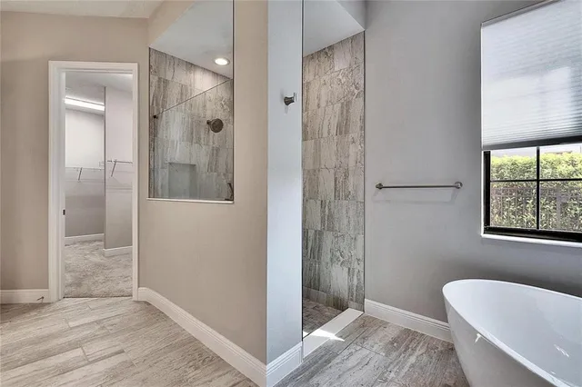a bathroom with a shower and a sink