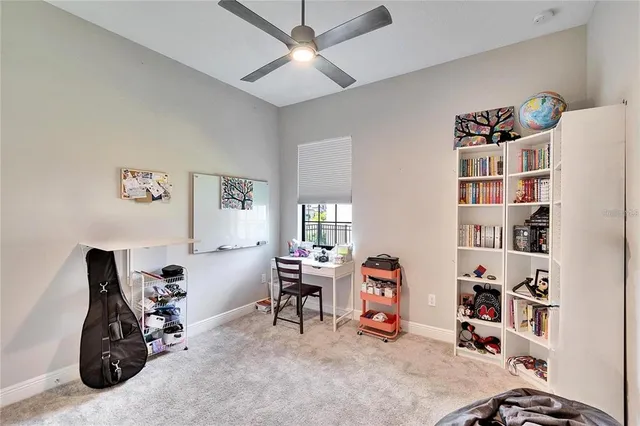 a bedroom with a bed and a desk