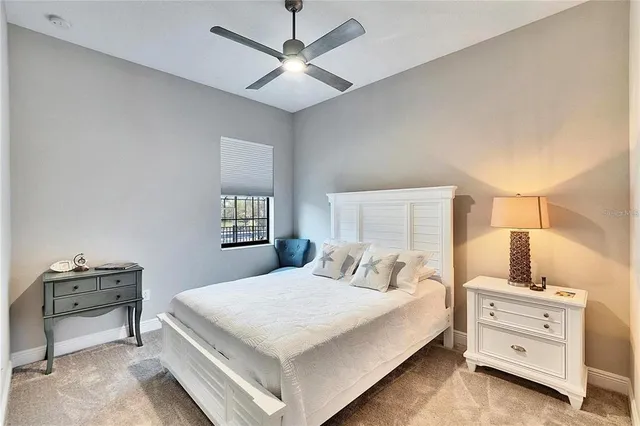 a bedroom with bed and a view of bathroom