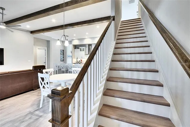 a bathroom with a sink a toilet and shower curtain