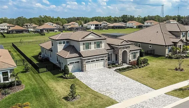 a view of swimming pool with sitting area
