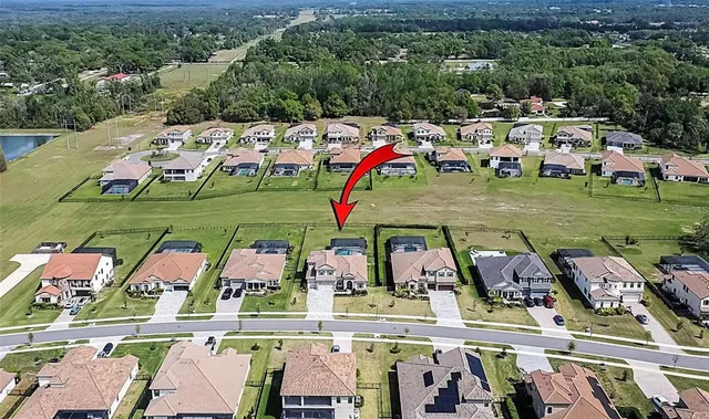 a view of a patio with a table and chairs