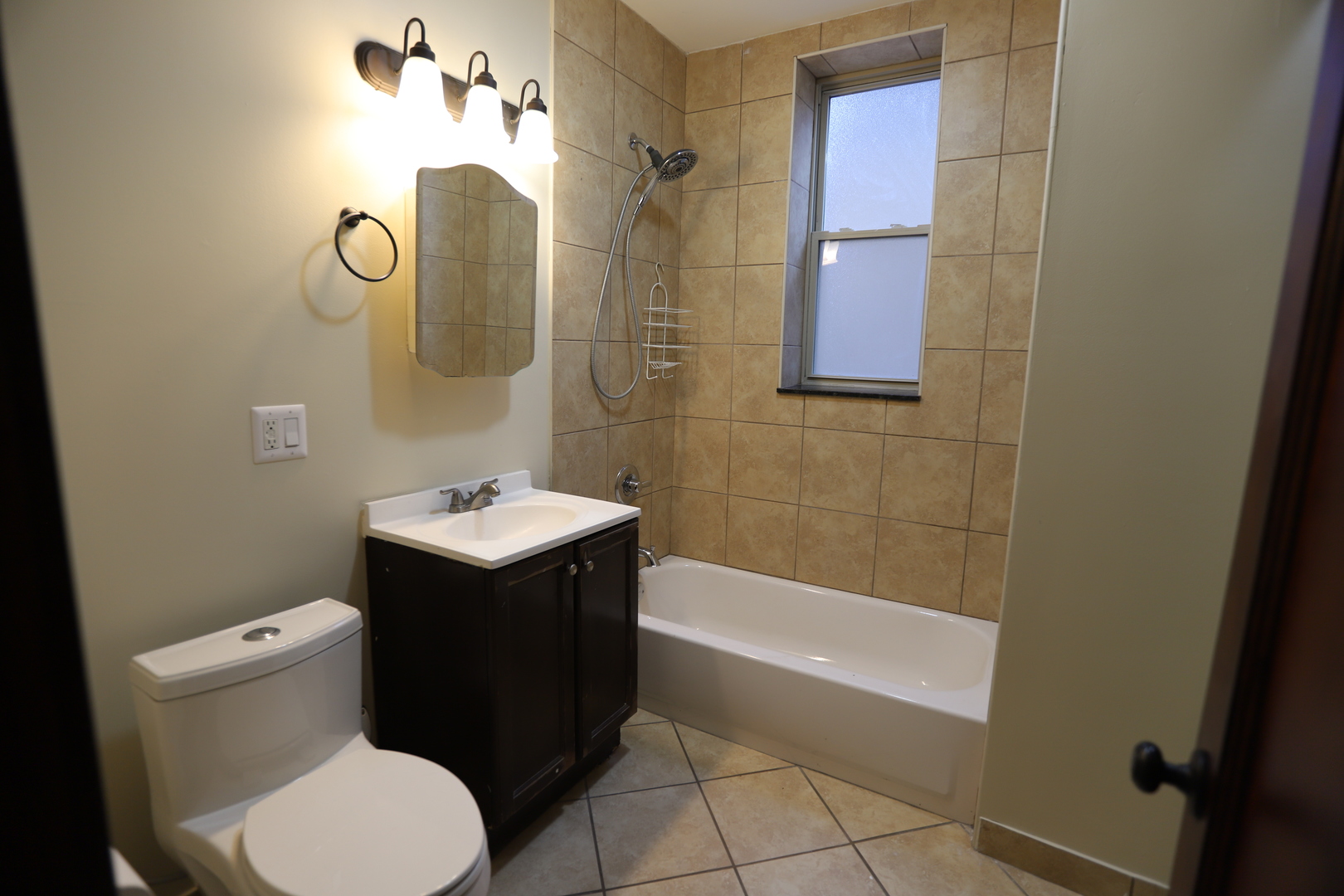 2320 West Armitage Avenue, Unit 1 Chicago, IL 60647 - Photo 3 of 11 a bathroom with a sink toilet and shower